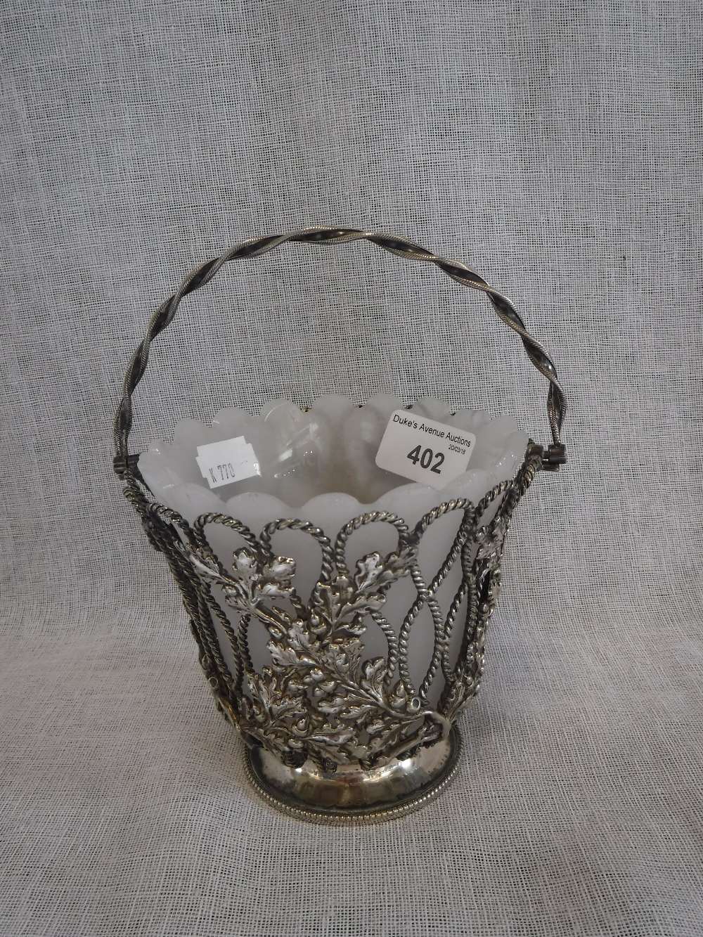 ELKINGTON & CO: AN OPENWORK SILVER PLATED BASKET with glass liner