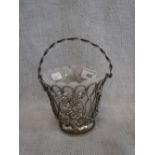 ELKINGTON & CO: AN OPENWORK SILVER PLATED BASKET with glass liner