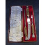 A EDWARDIAN SILVER PLATED AND ANTLER HANDLED CARVING SET, in fitted red leather case by Asprey &