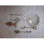 A STERLING SILVER PEPPERPOT, a silver mustard spoon, tongs, an enamelled spoon and a Continental