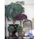 A PAIR OF CAST RESIN GARDEN URNS, 25 cm high, a larger metal urn containing an artificial palm