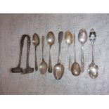 A COLLECTION OF SILVER TEASPOONS and a pair of silver tongs (c.137gms)