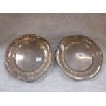 A PAIR OF SILVER SALVERS, the reverse marked 'Goldsmiths & Silversmiths Co, 112 Regent Street' (c.