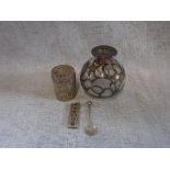 A SLVER INGOT, a white metal filigree container, a white metal coin spoon and a glass perfume bottle