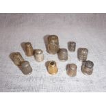 A COLLECTION OF SILVER AND WHITE METAL THIMBLES