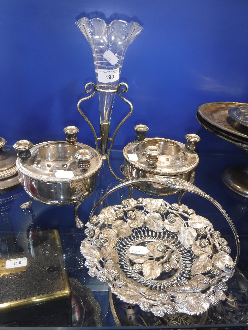 A SILVER-PLATED BASKET, decorated with blackberries and similar plated items