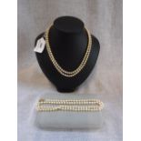 A SIMULATED SINGLE STRAND PEARL NECKLACE and one other double strand (2)