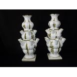 A PAIR OF CONTINENTAL CERAMIC SECTIONAL "TULIP" VASES, with individual flower sections, 37 cm high