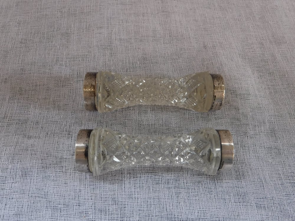 A PAIR OF CUT-GLASS AND SILVER RIMMED KNIFE AND FORK RESTS