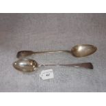 A FIDDLE PATTERN SILVER STUFFING SPOON and one other similar (c.209gms)