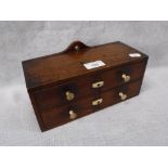 A 19TH CENTURY MINIATURE FOUR DRAWER CHEST, with ivory knobs and turn buttons, 25 cm wide