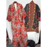 A VINTAGE KIMONO and a black housecoat with all over red, yellow and white geometric decoration (2)