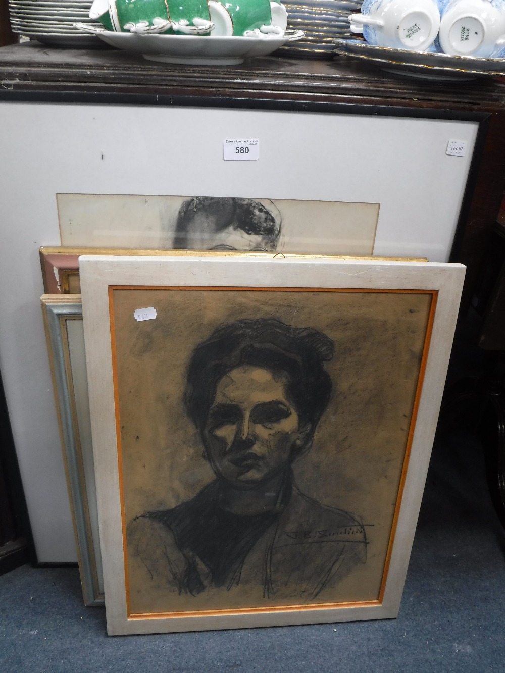 A BLACK CHALK PORTRAIT OF A WOMAN, signed 'GB SANTINI' and three other drawings