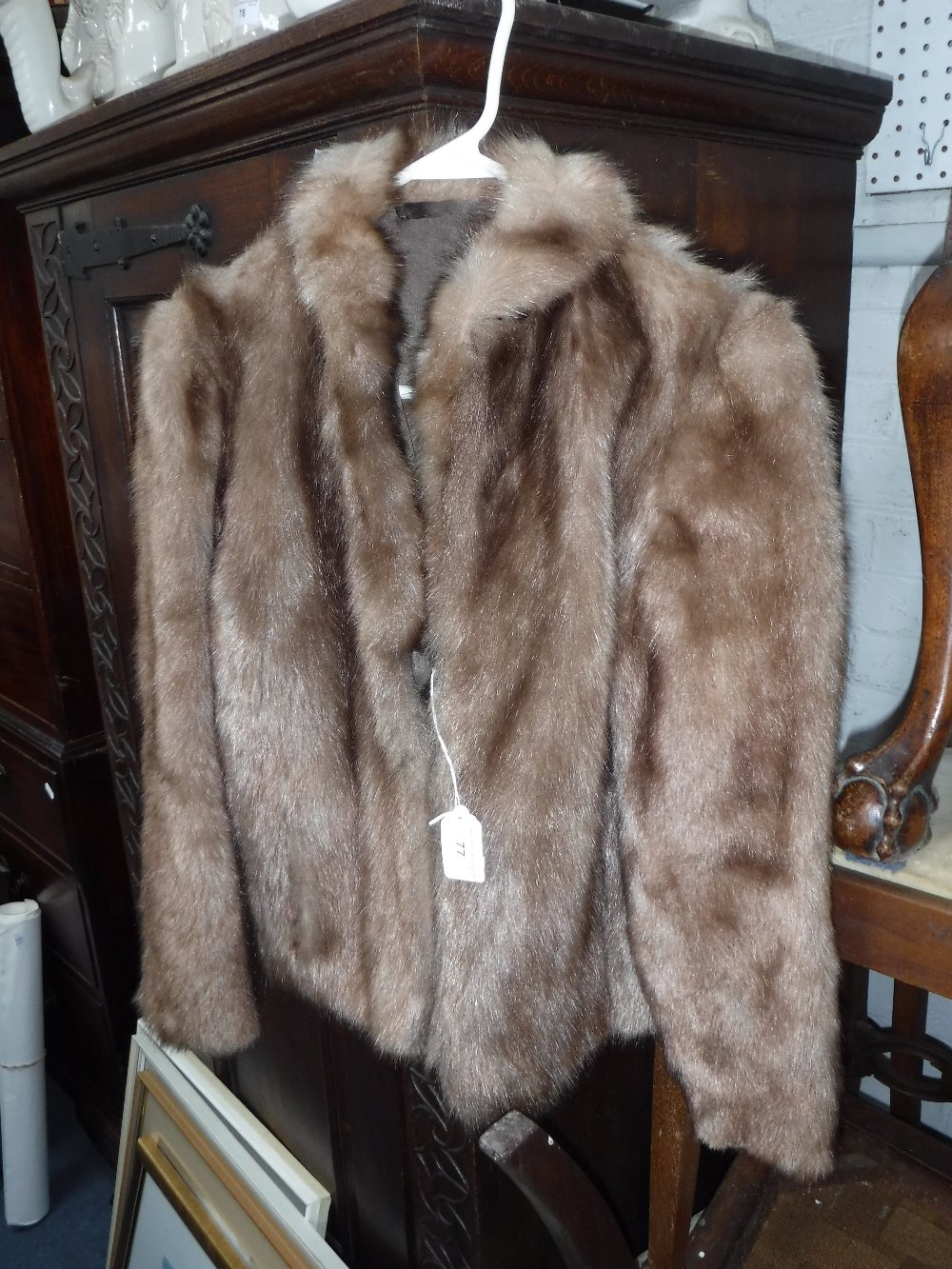 A LADIES WAIST LENGTH LIGHT BROWN FUR COAT with silk lining