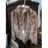 A LADIES WAIST LENGTH LIGHT BROWN FUR COAT with silk lining