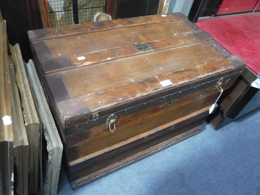 AN EARLY 20TH CENTURY METAL BOUND TRUNK, with label, "The Marshall Improved Air & Water Tight