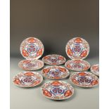 A SET OF TEN JAPANESE IMARI FOOTED PLATES, decorated with flowers, with faux Chinese marks, Edo,