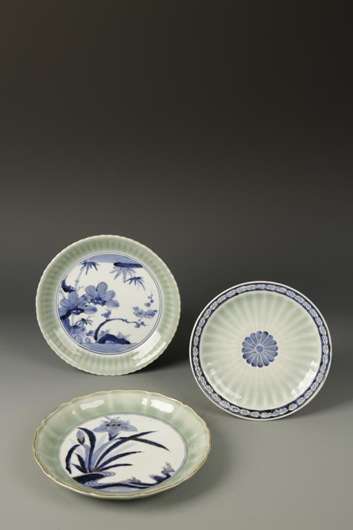 THREE JAPANESE ARITA BLUE AND WHITE CELADON DISHES, two with faux Chinese marks, Edo, 18th