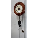 A VICTORIAN WALL CLOCK with a pitch pine case, with pendulum and weight the reverse painted glass