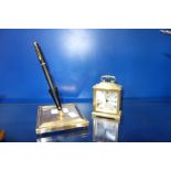 A VINTAGE BRASS PEN STAND with a Waterman pen and a small brass "Swiza" clock (2)