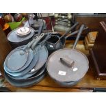 A COLLECTION OF 19TH CENTURY COPPER PANS and various lids