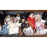 A COLLECTION OF VARIOUS PORCELAIN DOLLS