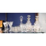 A SET OF SIX CUT-GLASS WINE GLASSES, three cut-glass decanters and a quantity of glassware