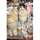 A LARGE COLLECTION OF STONEWARE FLAGONS and similar stoneware