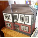 A RESTORED 1970'S MOCK TUDOR DOLLS HOUSE "Olde Tudors" fully furnished and decorated