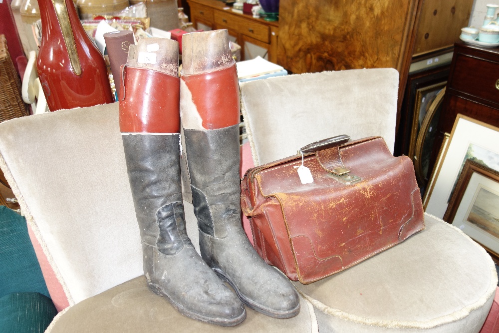 A PAIR OF VINTAGE RIDING BOOTS by Peal & Co London, with wooden stretchers and a Vintage leather