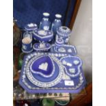 A COLLECTION OF WEDGWOOD BLUE JASPERWARE including dressing table items