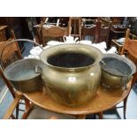 A VICTORIAN BRASS COOKING POT with an iron handle, a large brass jardiniere and a planter (3)