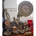 AN INDIAN BRASS CHARGER with embossed decoration with figures of soldiers and animals, 60 cms dia