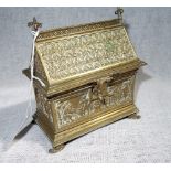 A 19TH CENTURY CONTINENTAL BRASS CASKET, the sides decorated with figures, 13 cm high