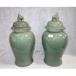 A PAIR OF CHINESE GREEN AND CRACKLE GLAZED LIDDED VASES, 48 cm high