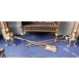 A SET OF THREE VICTORIAN STYLE BRASS FIRE-IRONS with a matching pair of fire dogs