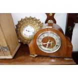 A 1950S WALNUT CASED MANTEL CLOCK and a gilt sunburst wall clock (2)