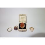 A COLLECTION OF DRESS RINGS including a cameo ring (4)