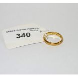 A 22CT YELLOW GOLD WEDDING BAND, ring size L