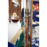 A LARGE COLLECTION OF FISHING RODS and a collection of fishing equipment