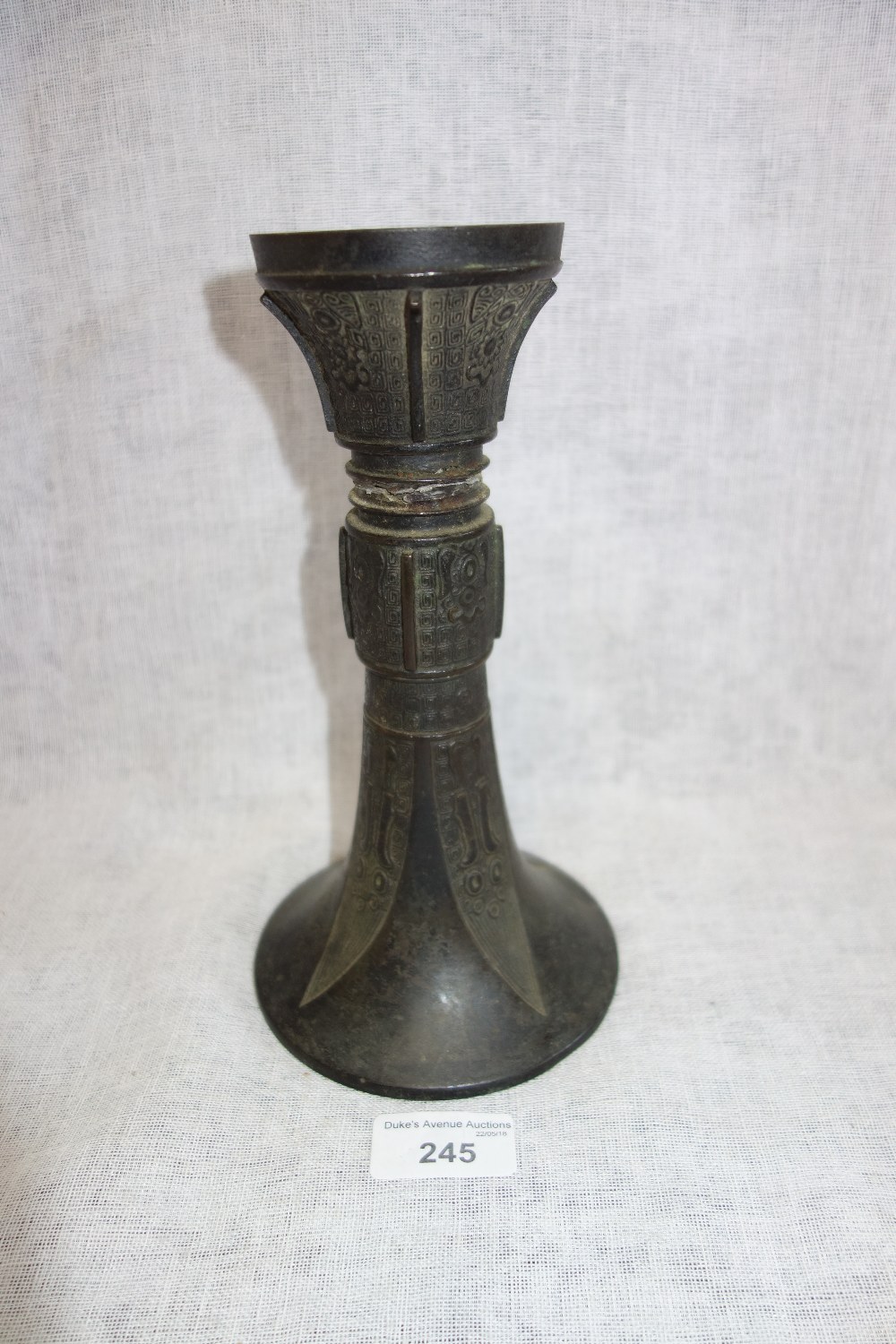A LATE MING ARCADIAN BRONZE STAND of circular form, 22 cm high
