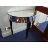 A CONTEMPORARY MIRRORED DEMI-LUNE SIDE TABLE, fitted two drawers with glass knobs on ebonised