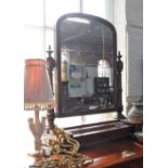 A VICTORIAN MAHOGANY DRESSING MIRROR, on turned columns, the base fitted three lift-up