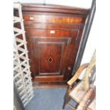 A GEORGE III OAK HANGING CORNER CUPBOARD with dentil cornice