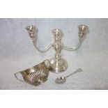 A SILVER THREE BRANCH CANDELABRA, a silver bowl and a teaspoon