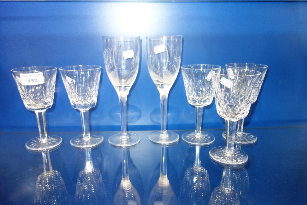 A PAIR OF LALIQUE WINE GLASSES, decorated with frosted angels, 20.5 cm high and five Waterford