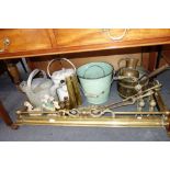 AN EDWARDIAN BRASS FENDER, fire tools, Vintage watering cans and sundries