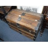 A 19TH CENTURY METAL BOUND TRAVELLING TRUNK