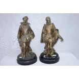 A PAIR OF GILT SPELTER STUDIES OF ELIZABETHAN GENTLEMEN IN PERIOD COSTUME on wooden plinths, 47 cm