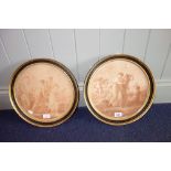 A PAIR OF STIPPLE ENGRAVINGS depicting classical scenes in gilt and ebonised circular frames